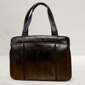 Vintage Ganson Black Leather Handbag with metal frame and inner clasp pocket